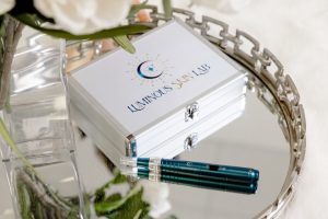ILUMIPEN professional microneedling and nano-infusion pen with its Luminous Skin Lab carrying case